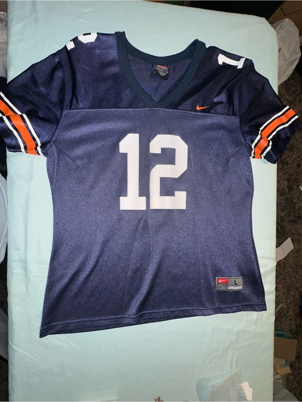 Nike Navy Football Jersey with White Number 12 and Orange Accents
